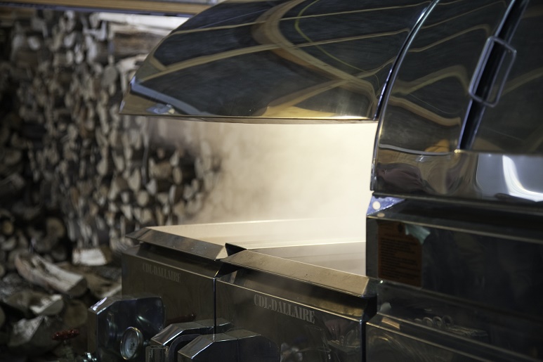 Steam rises from a maple sugar evaporator, making maple syrup at Phyllis Hayward's East Hill Farm